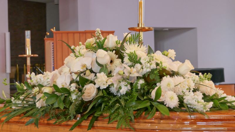 casket at funeral death benefits