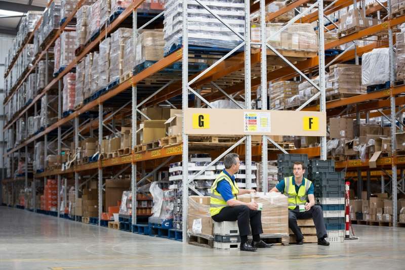 warehouse workers chatting