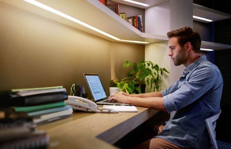 Man reviewing his work injury on a laptop