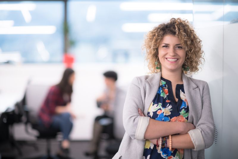 Smiling working standing and working in an office