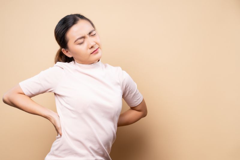 Woman experiencing pain in her lower back