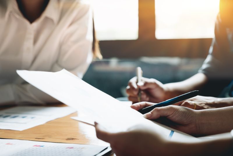 Businessman reviewing paperwork together