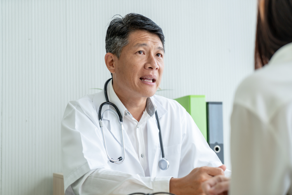 Doctor having a serious discussion with a patient