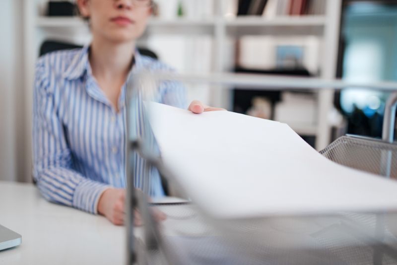 Employer doing paperwork in her office